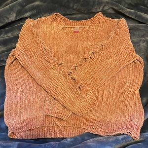 Rose sweater. Very soft, with cutout v neck. Braided strips on sleeves.